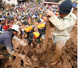 Mud breaches dams in Indonesia  